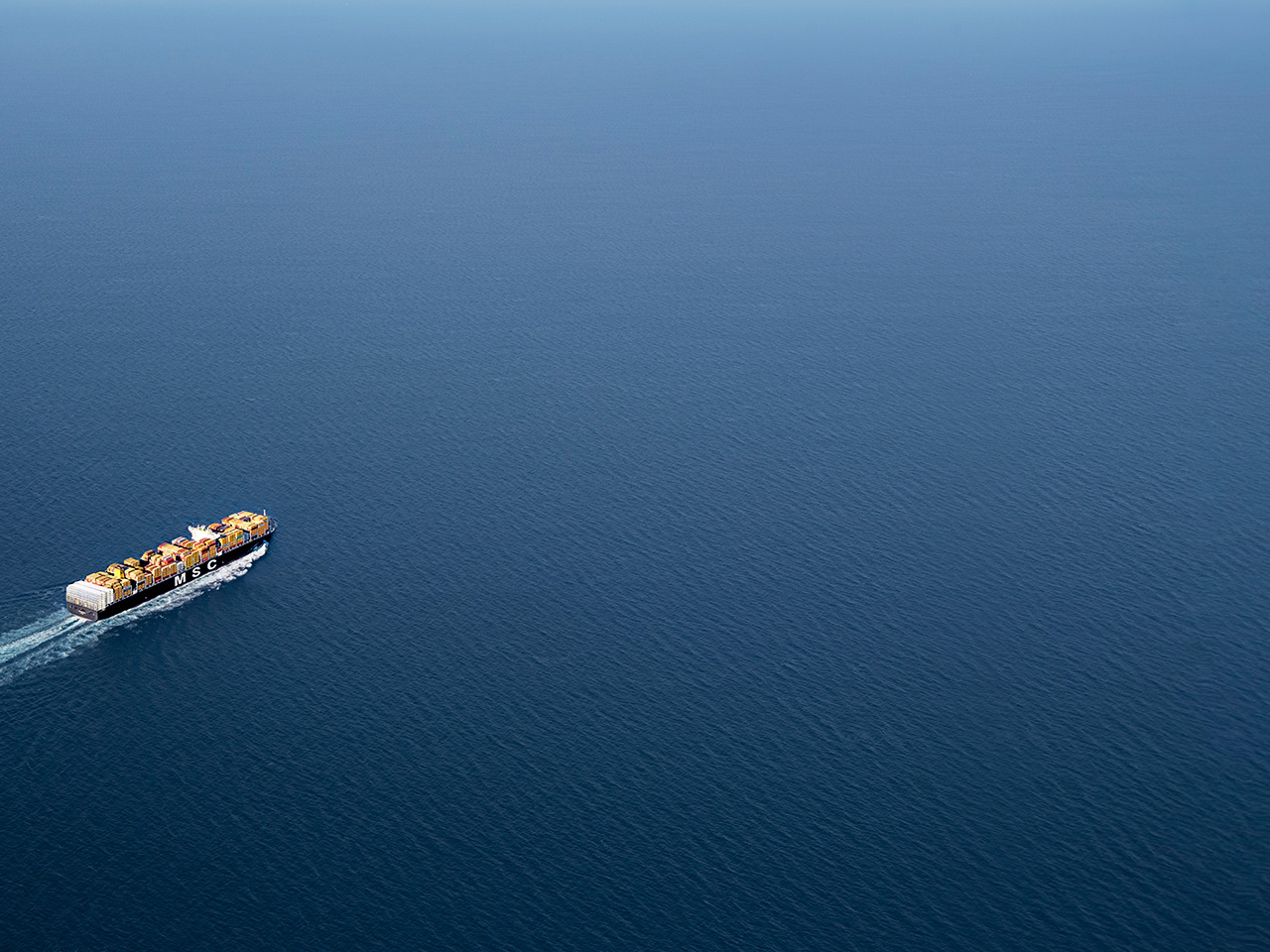 MSC vessel aerial image sailing on deep blue sea