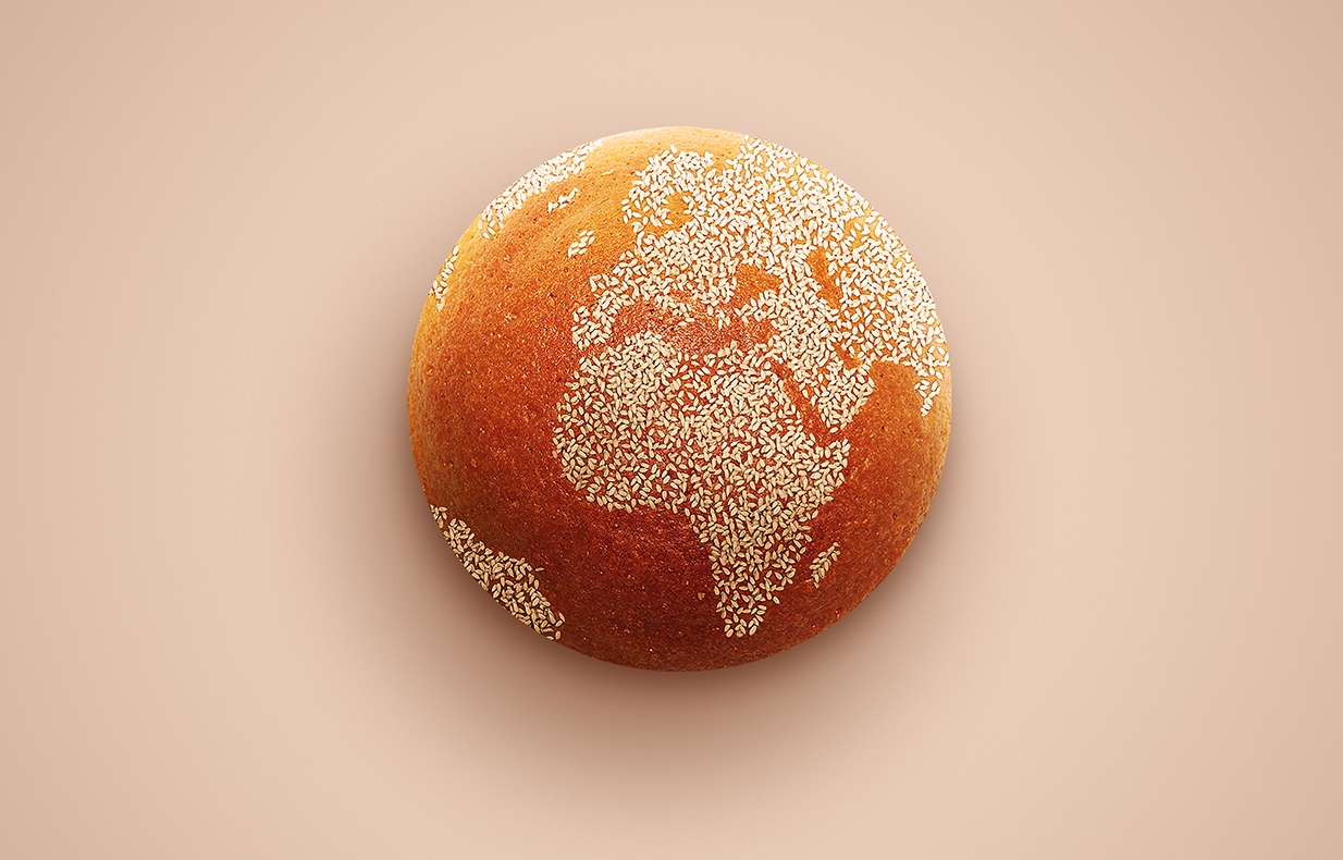 Orange like a globe with sesame seeds depicting the continents