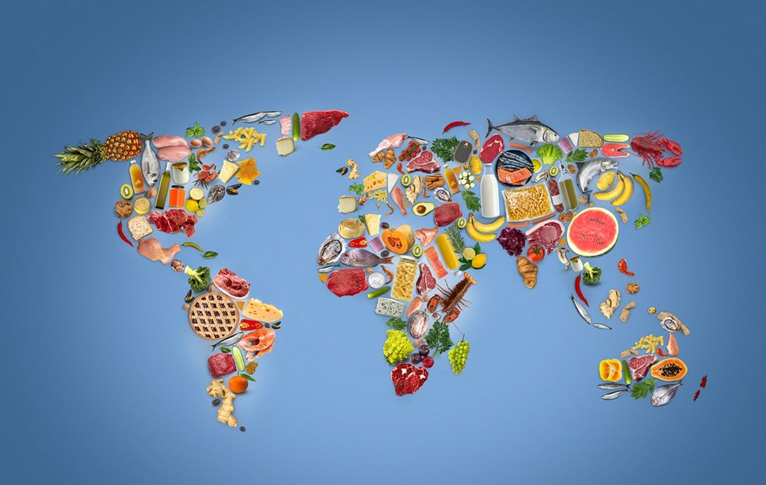 World map created by various types of food, with each continent filled with different food items, set against a light blue background.